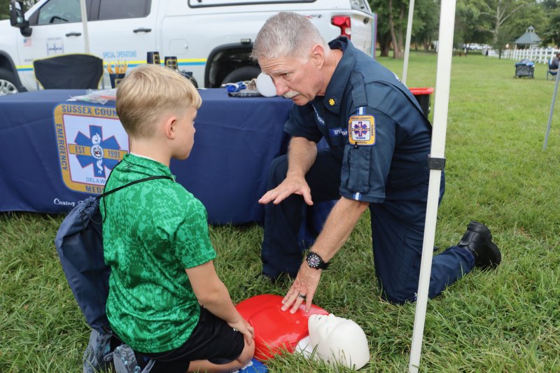 Thomas Keener, left, learns CPR from Glenn Marshall of Sussex County EMS.
